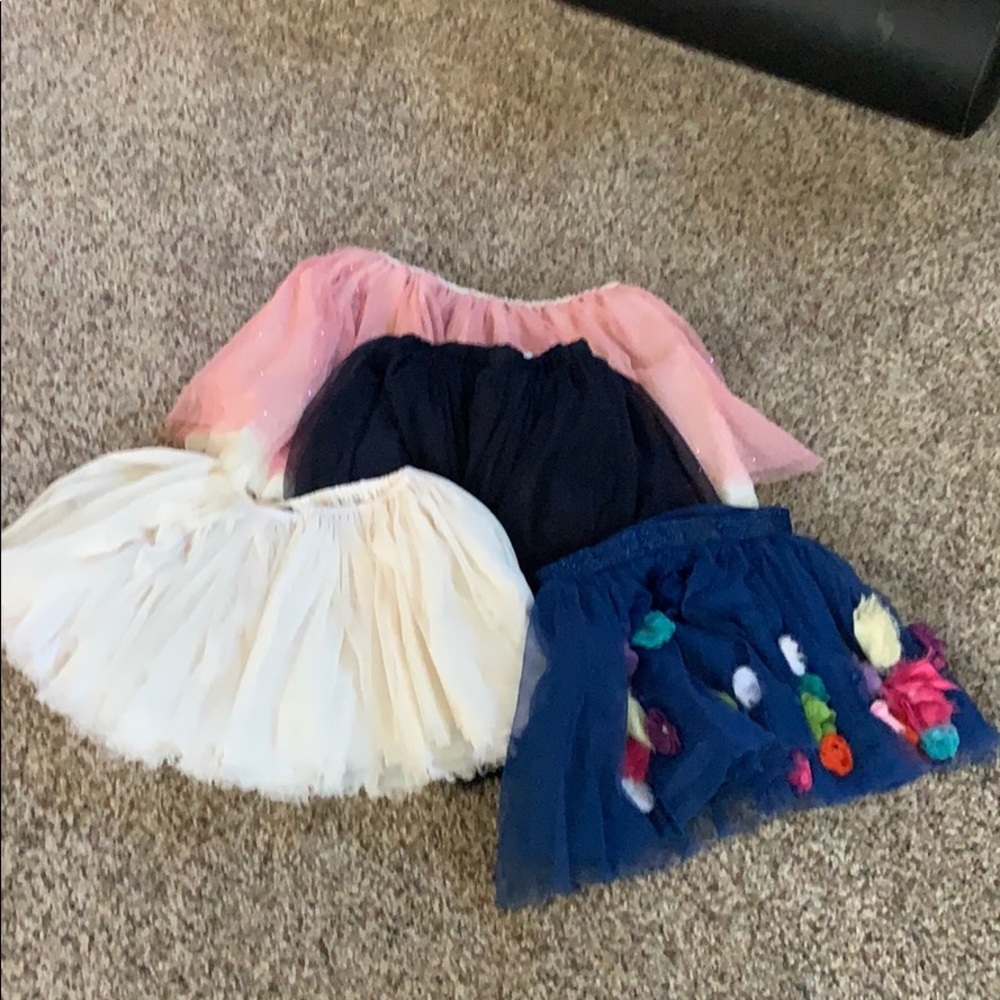 Skirts: dark pink is bigger in size, others 6-6x